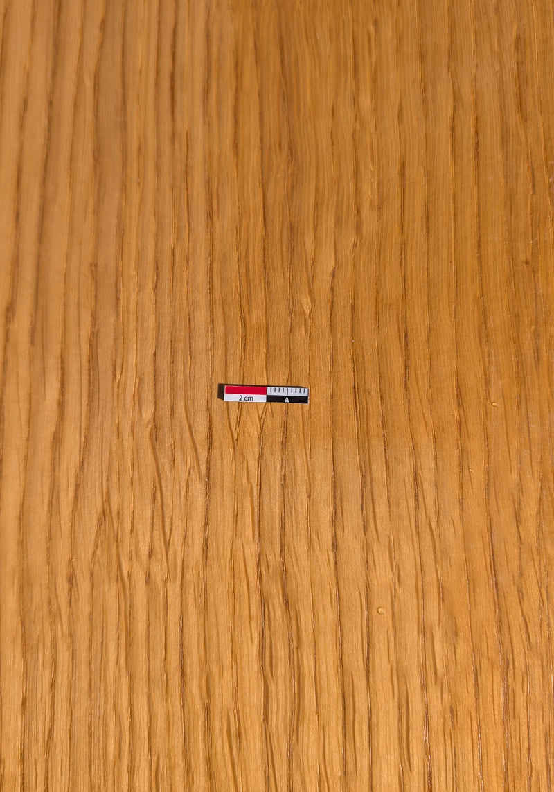 Load image into Gallery viewer, Close-up of a 2cm magnetic archaeological photo scale in red-white-black on a wooden surface. Flexible magnetic material. Made in France.