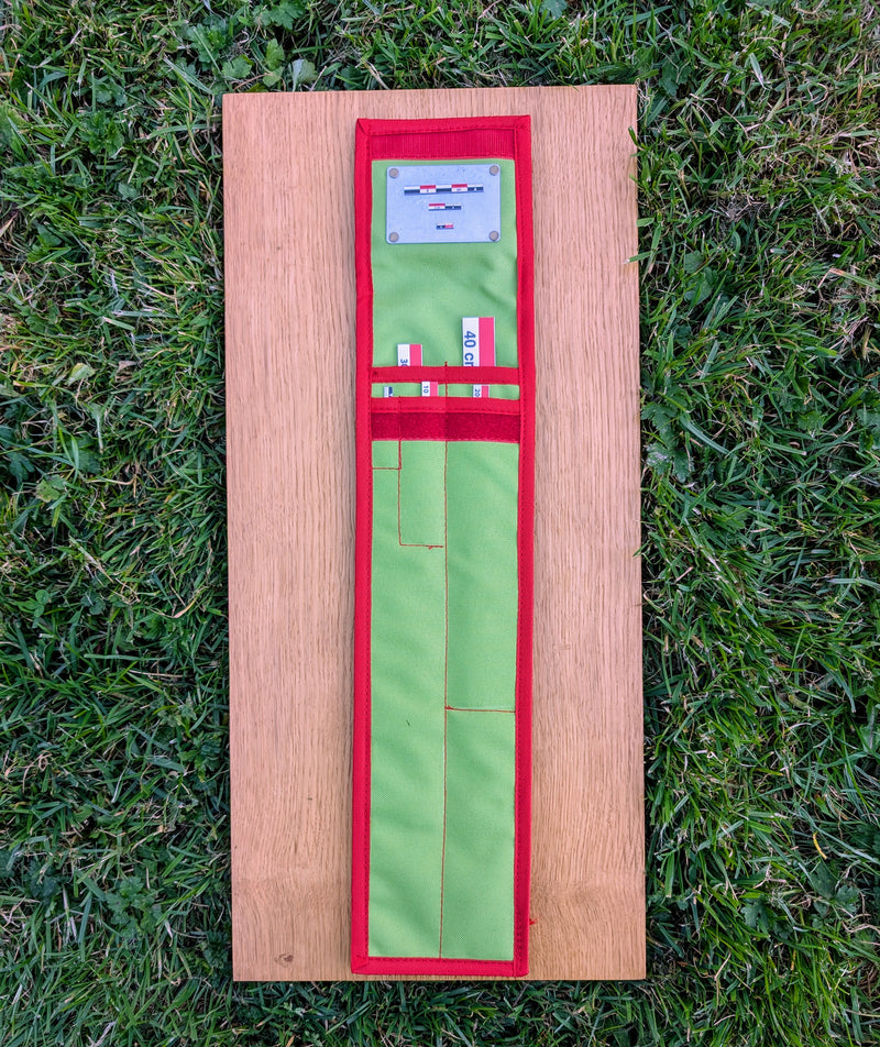 Load image into Gallery viewer, CAMA 40 cm red-white-black archaeological photo scale kit opened flat with storage case on grass