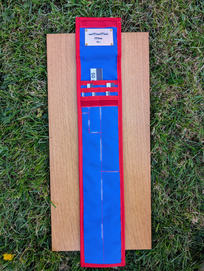 Load image into Gallery viewer, CAMA 50 cm black and white archaeological photo scales with open blue and red STRATI storage case on wood