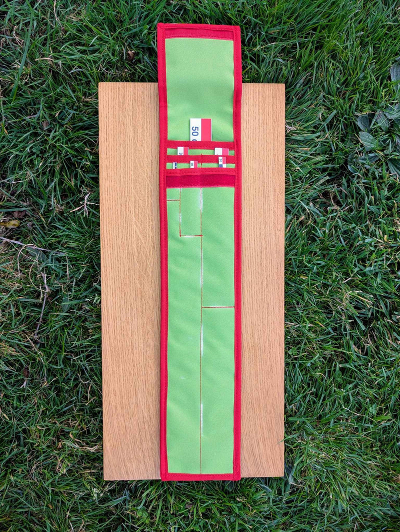 Load image into Gallery viewer, CASE 50 cm archaeological photo scale kit opened on wood with red-white-black scales and green carrying case