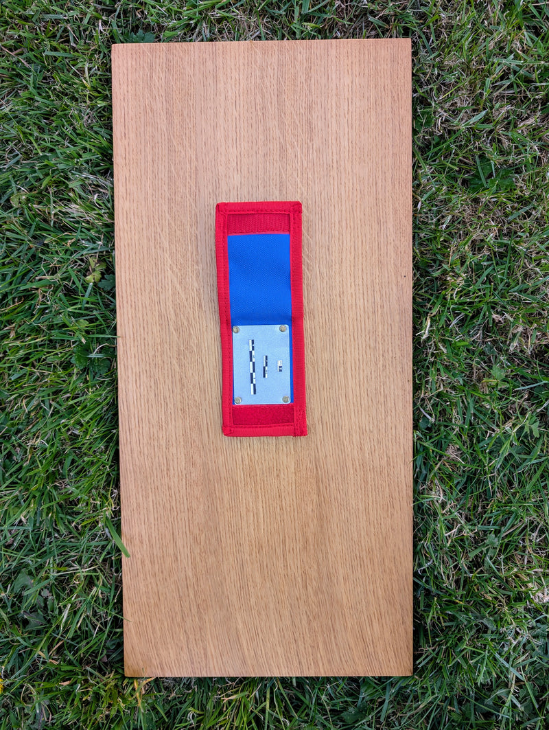 Load image into Gallery viewer, Open Strati MicroMagnet black-white magnetic scale set in red and blue fabric pouch on wood and grass