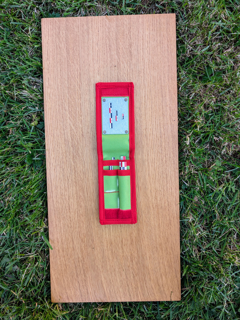 Load image into Gallery viewer, Open Strati Minimix+ red-white-black compact case with small archaeological photo scales on wood over grass