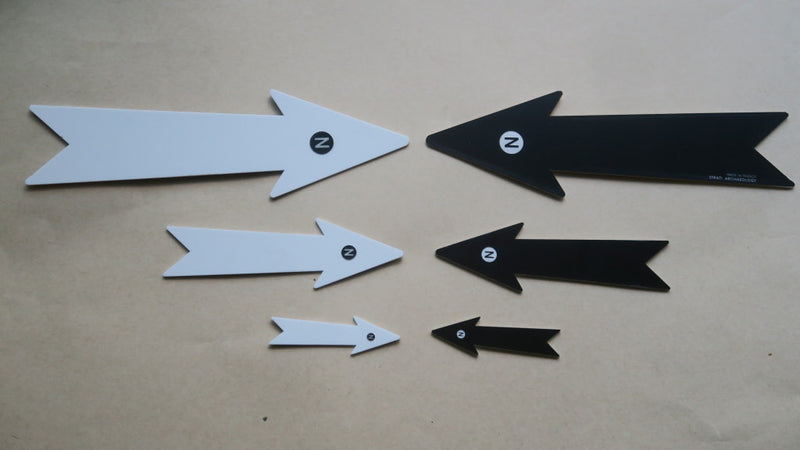 Load image into Gallery viewer, Set of three white and black archaeological north arrows in 7, 13 and 21 cm sizes on beige background
