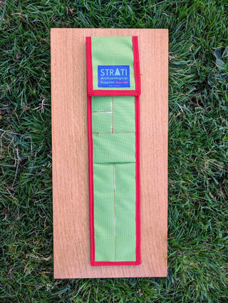 Chargez l'image dans la visionneuse de la galerie, Closed CANO 50 cm green and red STRATI carrying case for archaeological photo-scale kit on wood over grass
