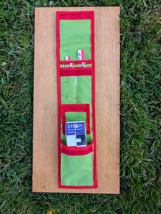 Open CASE 40 cm CANVAS photo scale kit in a green and red Strati roll case on a wooden board