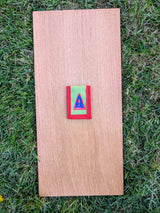 Closed Strati MicroMagnet red-white-black magnetic scale pouch with red border on wood over grass