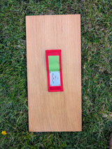 Open Strati MicroMagnet red-white-black magnetic scale set in red and green pouch on wood over grass