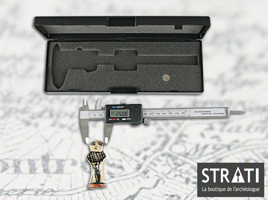 150 mm digital precision caliper with black storage case measuring a small archaeological figurine