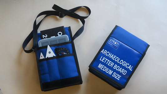 Medium reinforced archaeological letter board kit with blue case, letters, numbers, north arrows and compass