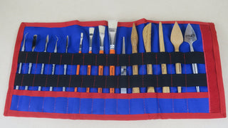 Chargez l'image dans la visionneuse de la galerie, Open red and blue SCADS three-section tool roll with sculpting tools, metal picks and brushes on beige background

