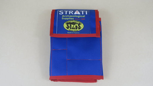 Closed blue and red Strati SCADS three-section archaeological tool case on light gray background