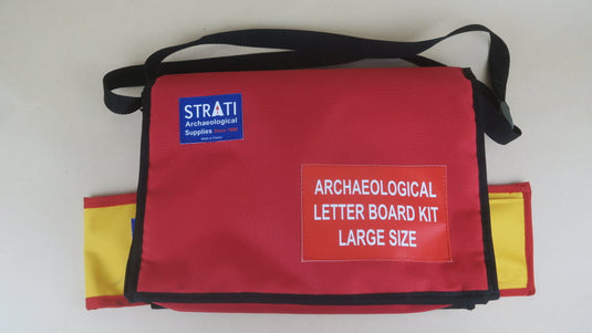 Red large size STANDARD archaeological letter board kit bag with black strap, yellow panels and STRATI logo on white background