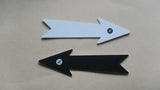 Two 13 cm white and black forked-tail north arrows on beige background