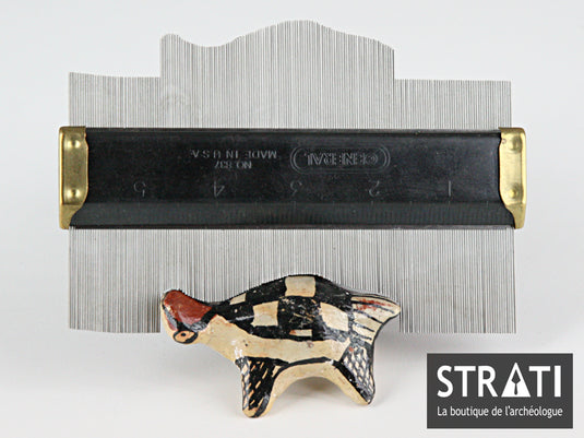 15 cm stainless steel profile gauge with black body and brass ends on white background