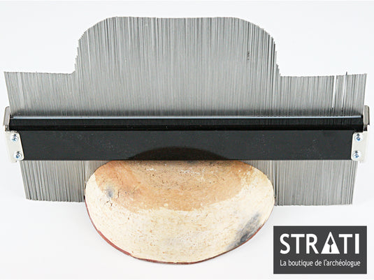 30 cm stainless steel contour profile gauge copying the shape of a ceramic fragment for archaeological recording
